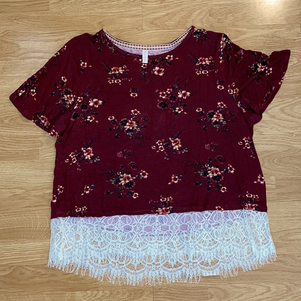 Burgundy floral top with lace at the bottom
